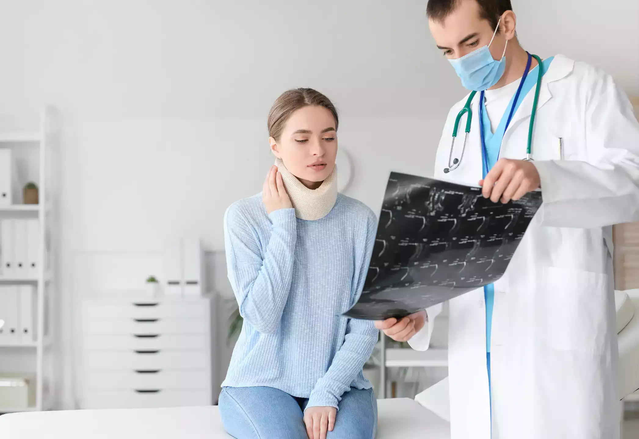 A plaintiff is injured in his neck and the doctor is showing the x ray reports to her